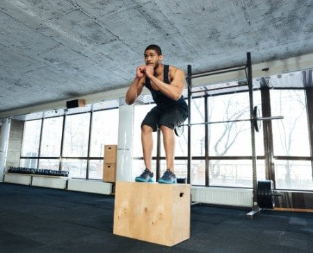 man jumping on box jump at reisterstown gym