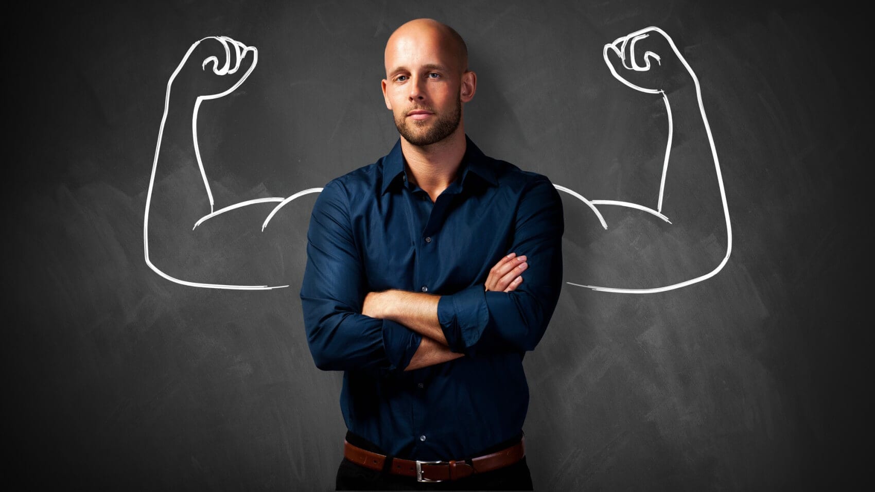 man infront of chalk board with muscles sketched in chalk