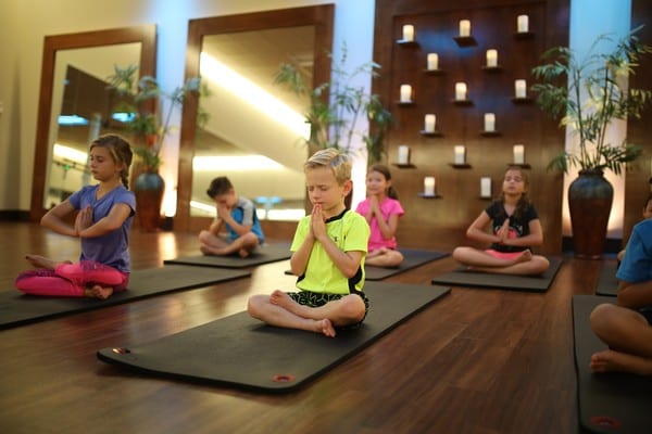 children in youth fitness yoga classes at brick bodies gyms