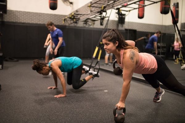 fitness members working out in inferno group classes at brick bodies gyms