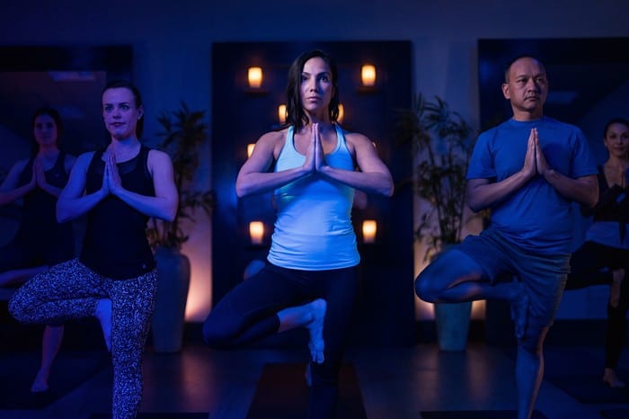 fitness members in reisterstown yoga studio in tree pose