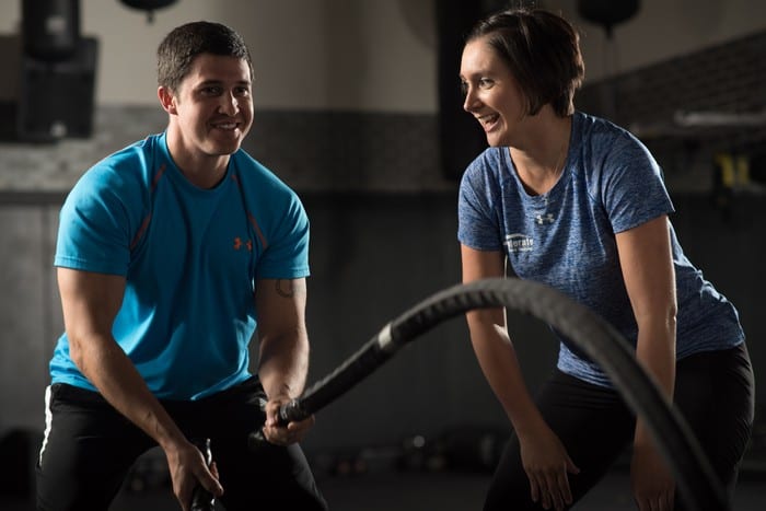 personal trainer encouraging male gym member at rotunda