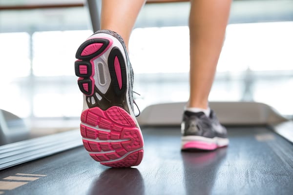 female gym member on treadmill at gym in padonia md