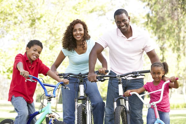 young family using brick bodies gyms tip to outdoor exercise using bicycles