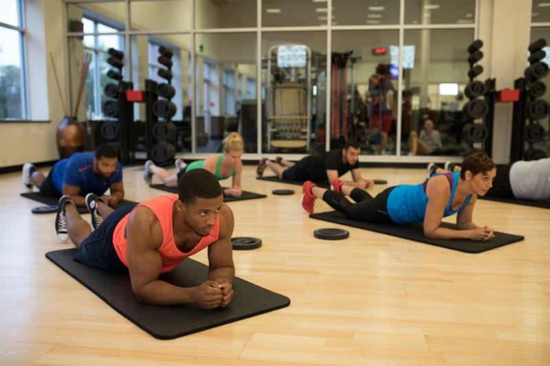 les mills group fitness class in padonia working out on mats to build strength at gym