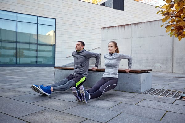 couple exercising outdoors of brick bodies padonia and rotunda