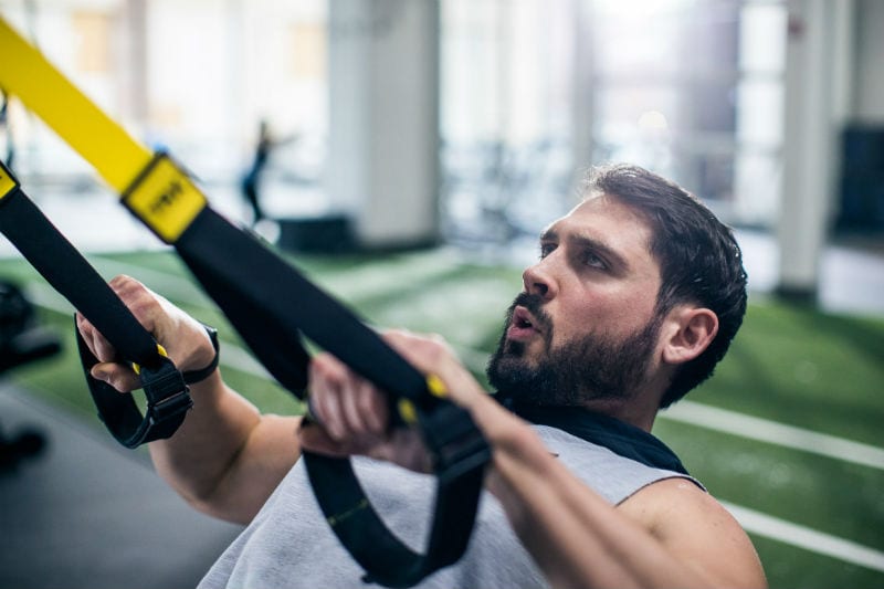 fitness member in trx team training program at rotunda gym