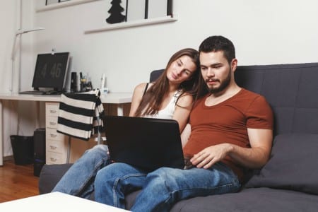 couple at home watching mobility exercises provided by brick bodies reistertown md gym