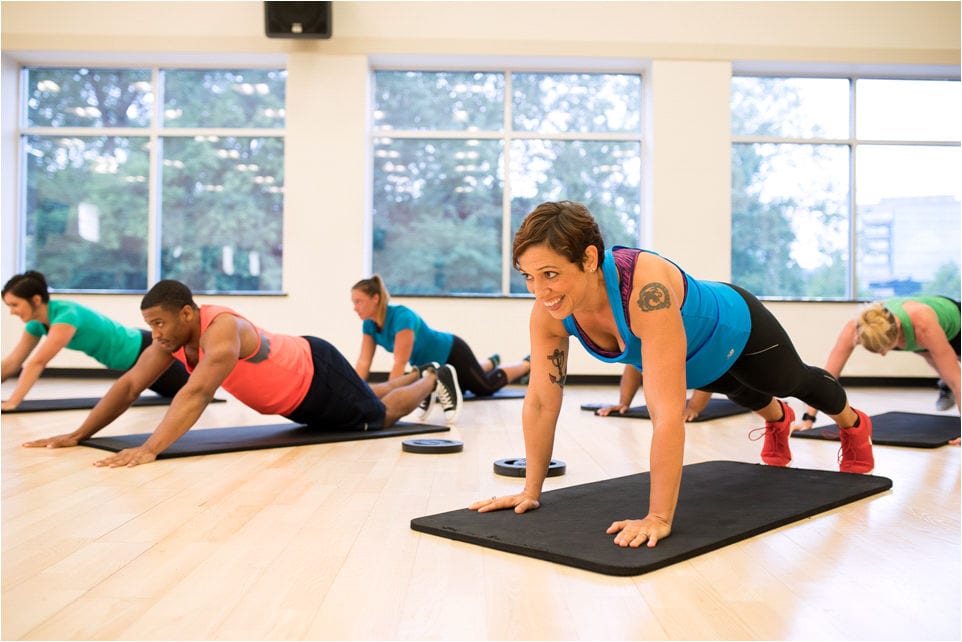 reistertown gym members on mats in team training group class