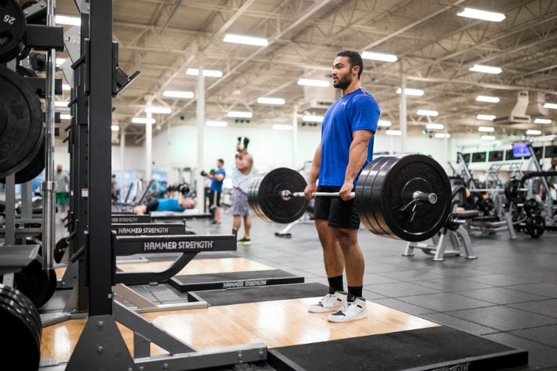 male gym member at brick bodies rotunda md holding deadlift weights