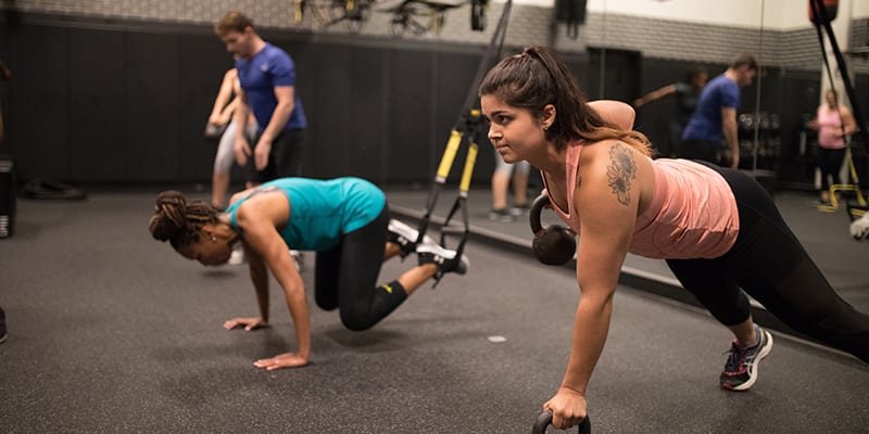 padonia gym members in trx group classes using suspension bands and kettlebells