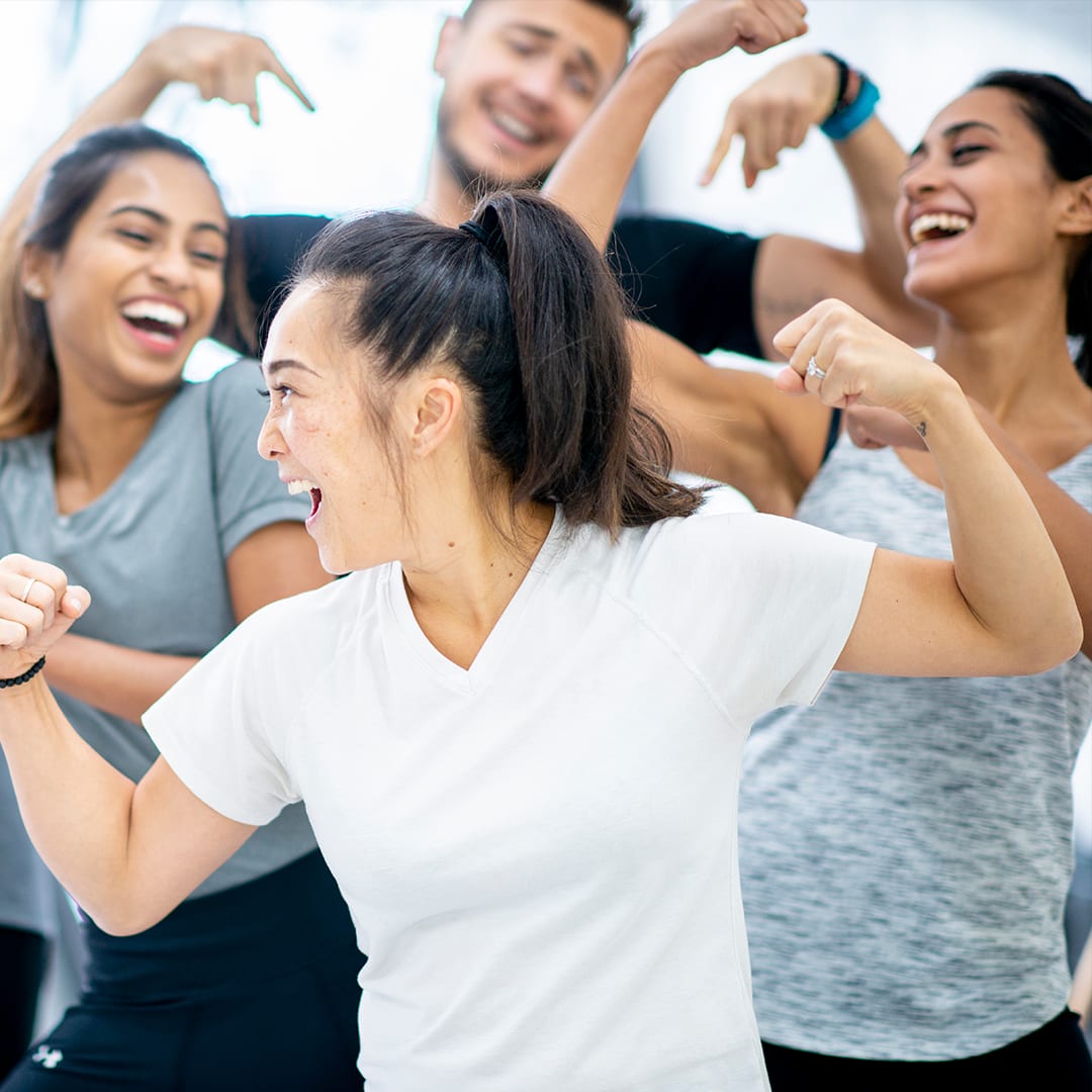 woman enjoying kickboxing class