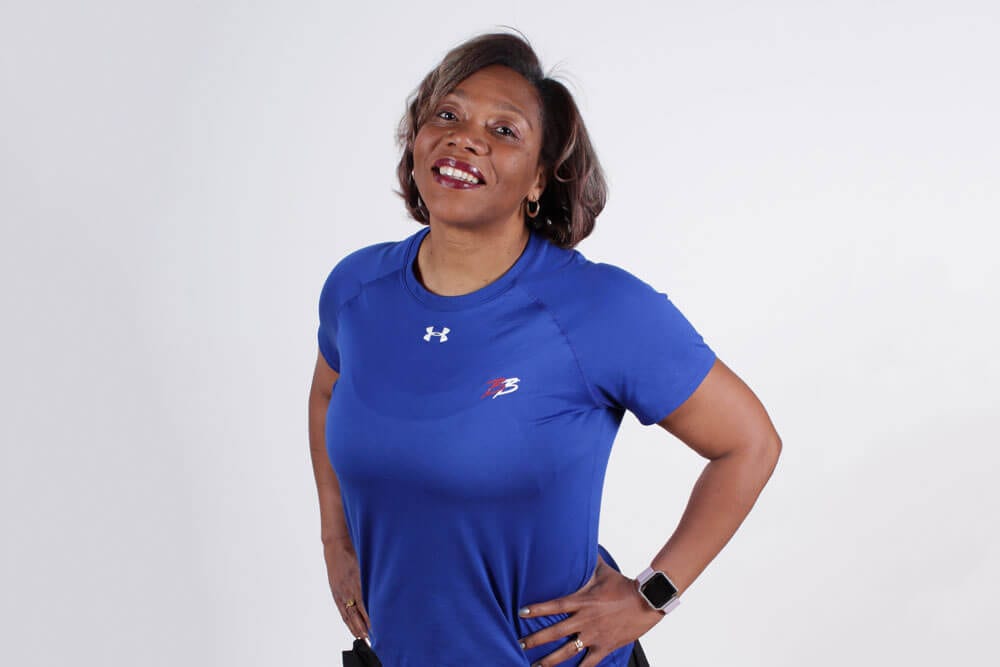 Verconia Samuel Personal Trainer at Brick Bodies gym in Baltimore wearing a blue shirt and smiling