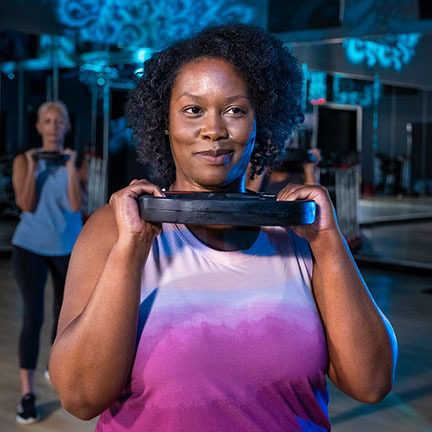 African American woman lifting weights