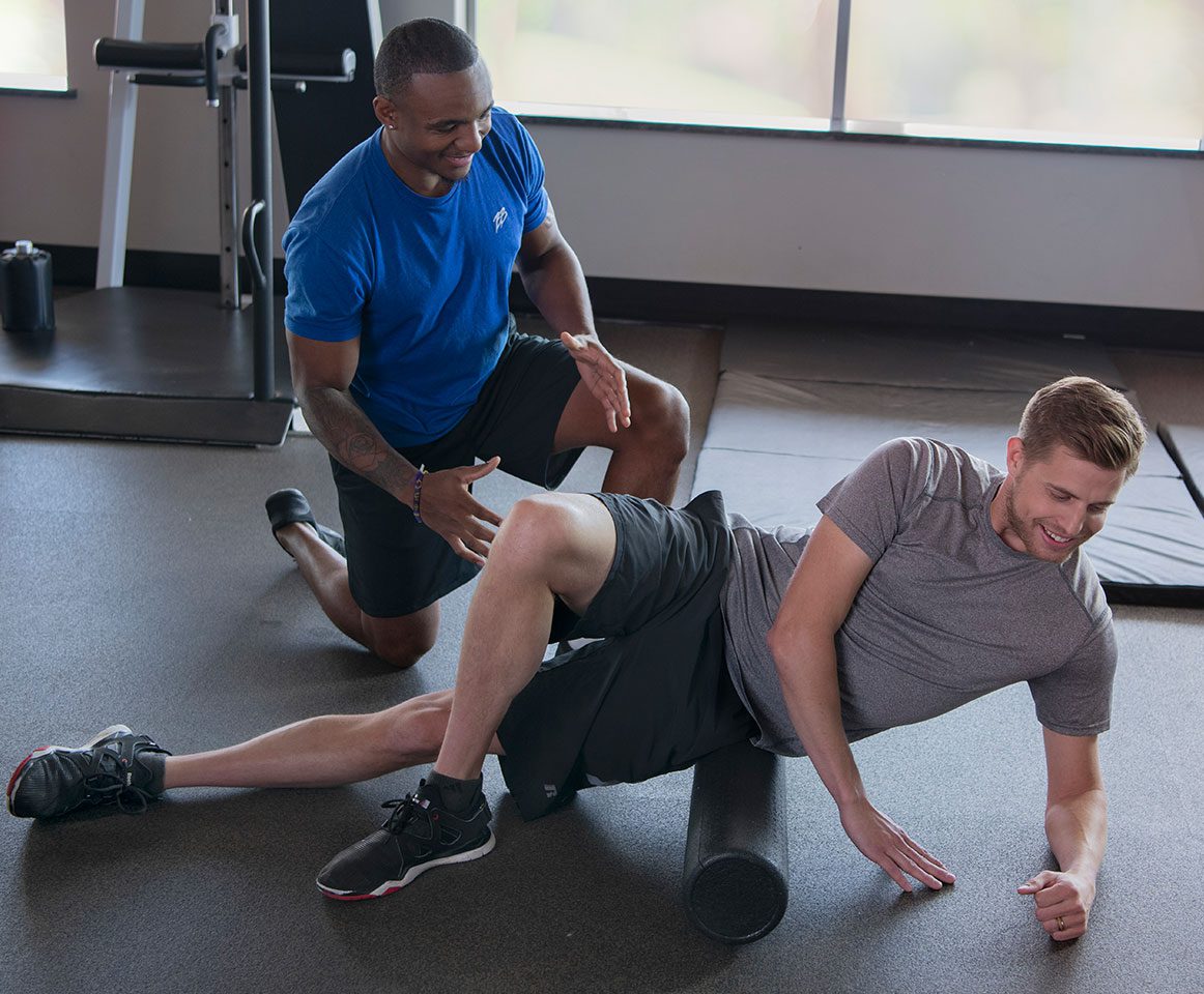 certified personal trainer in Baltimore working with a gym member