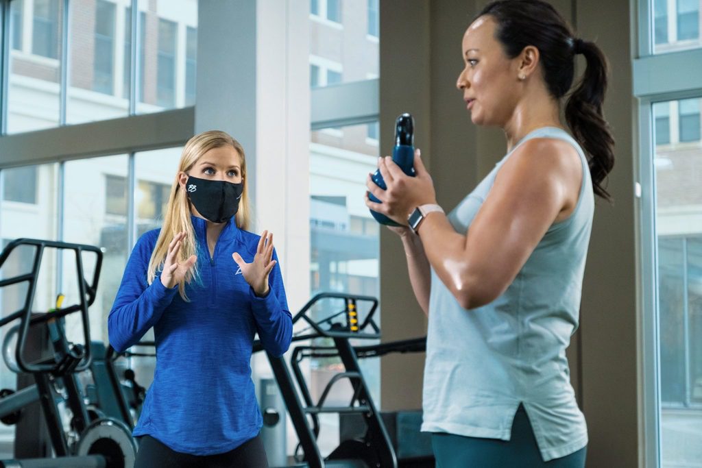 Personal trainer with mask on