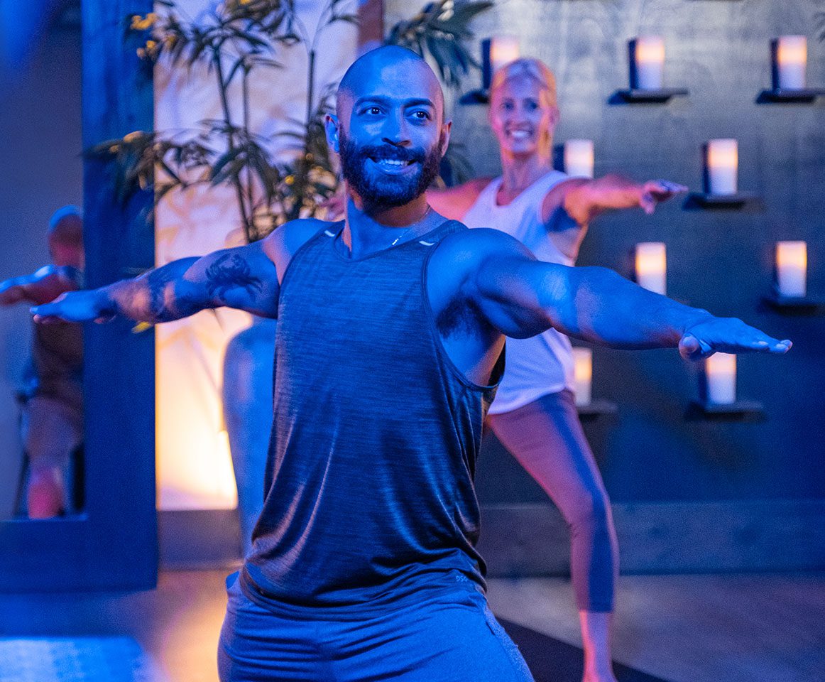 Smiling man doing yoga