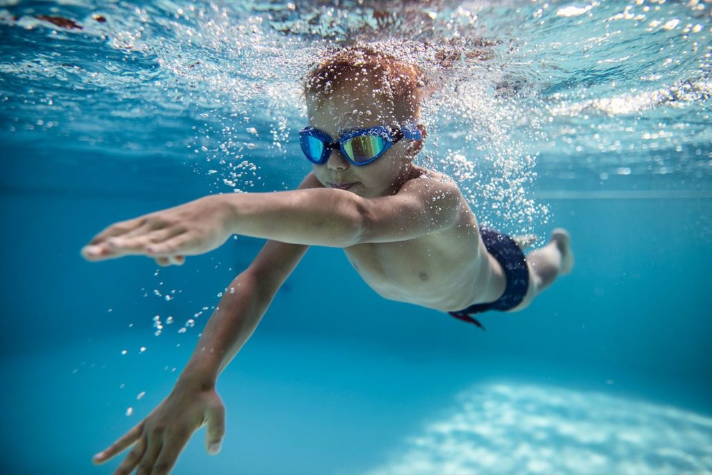 Boy swimming underwater