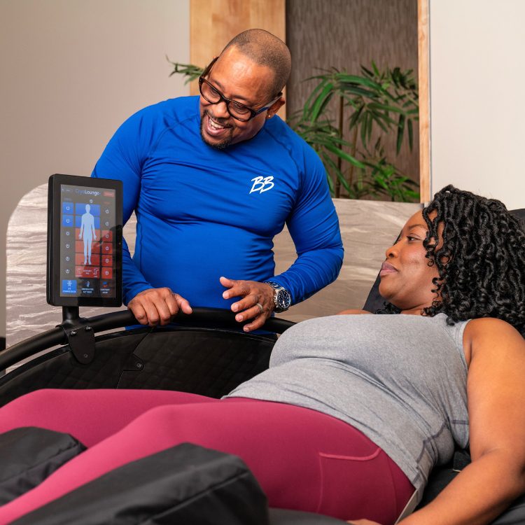 brick bodies team member helps a woman with cryolounge therapy